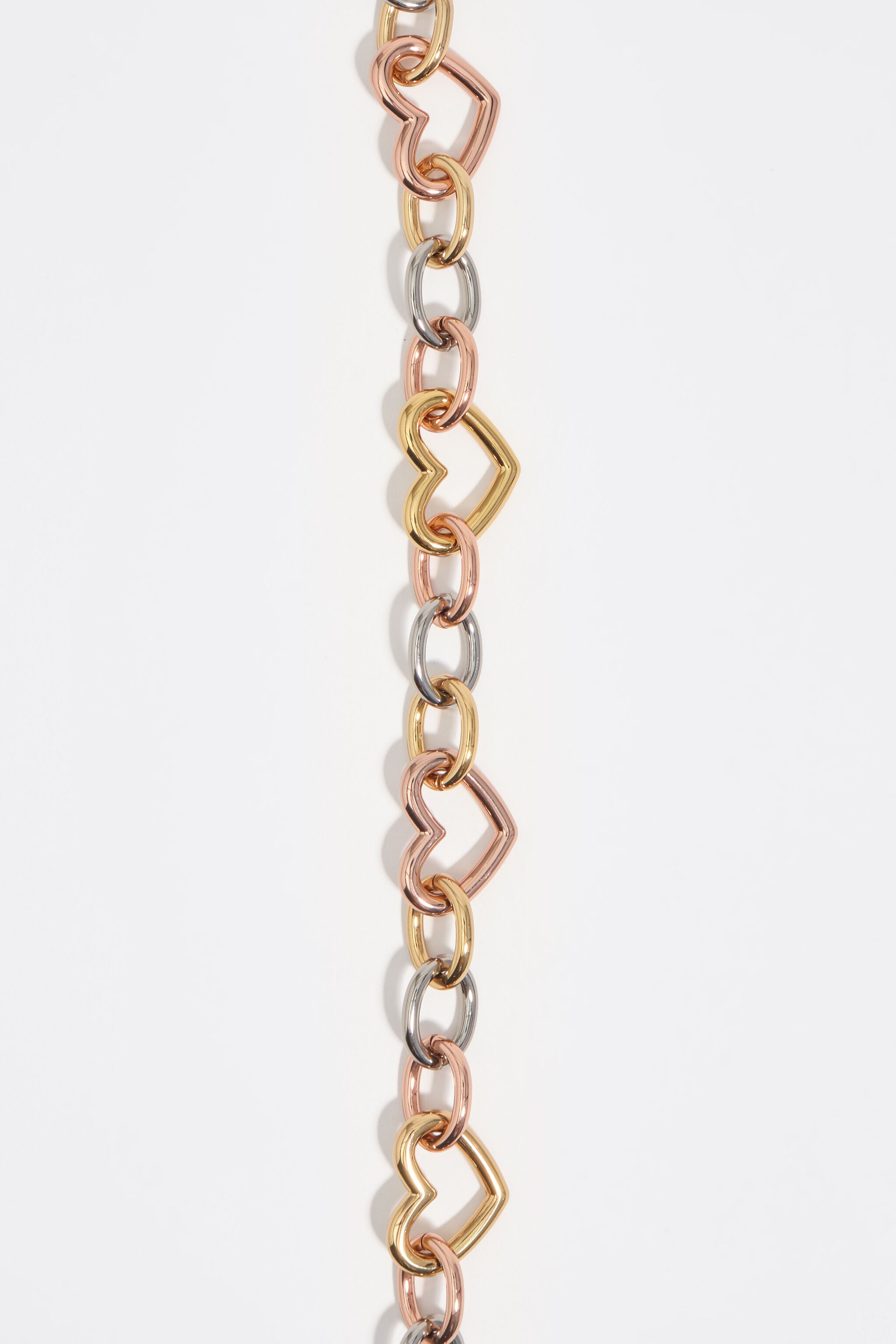 Collar de cadena con corazón de tres tonos