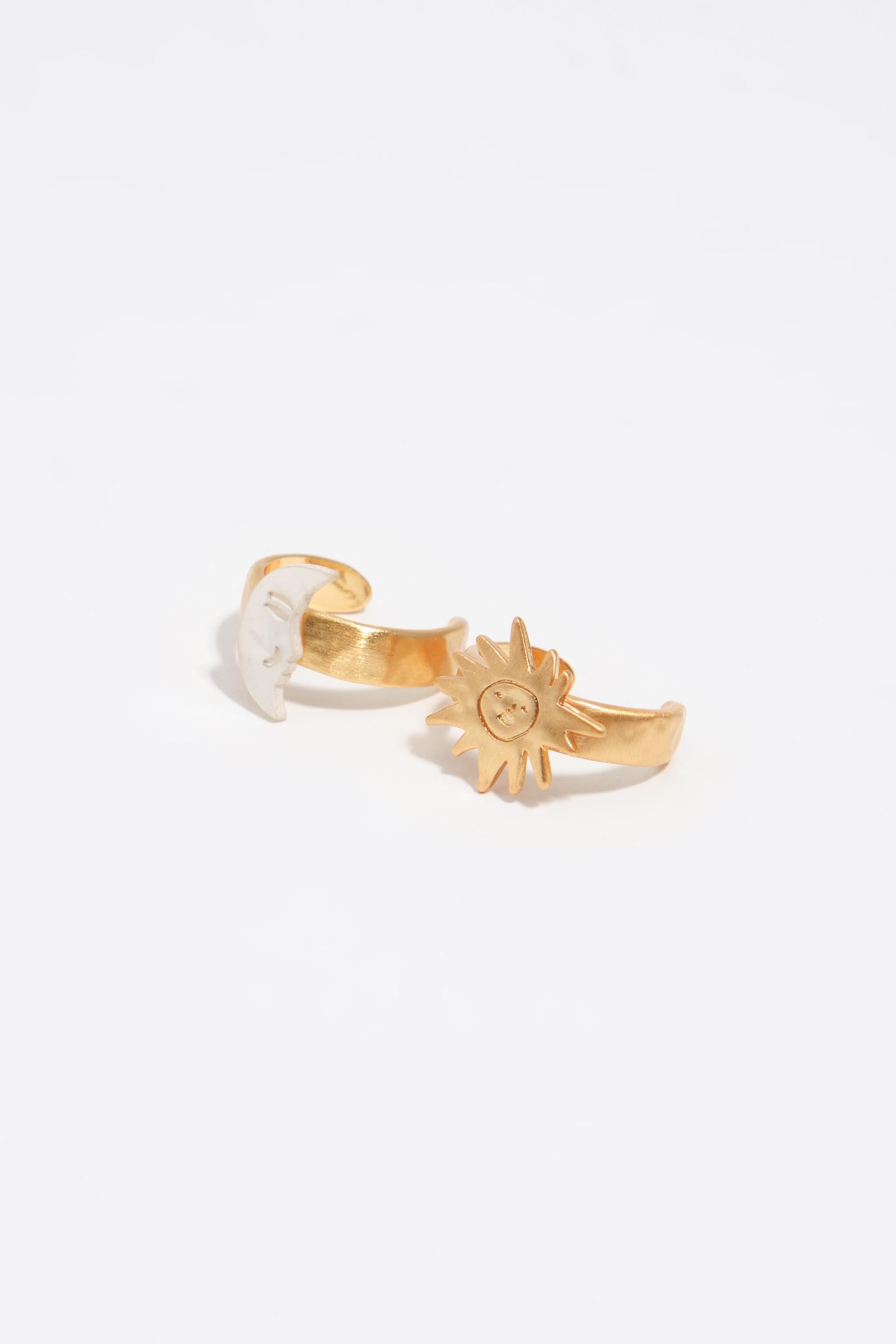 Conjunto de 2 anillos pequeños de sol y luna con madreperla