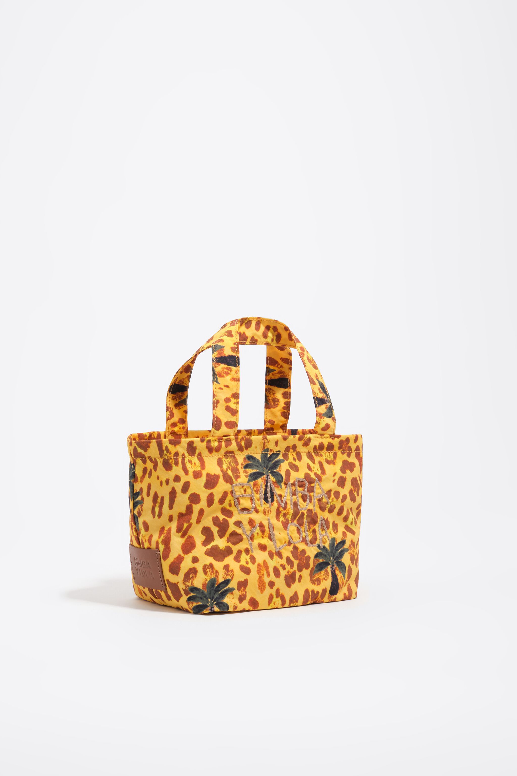 Bolso mini de nailon con estampado de palmeras leopardo amarillo