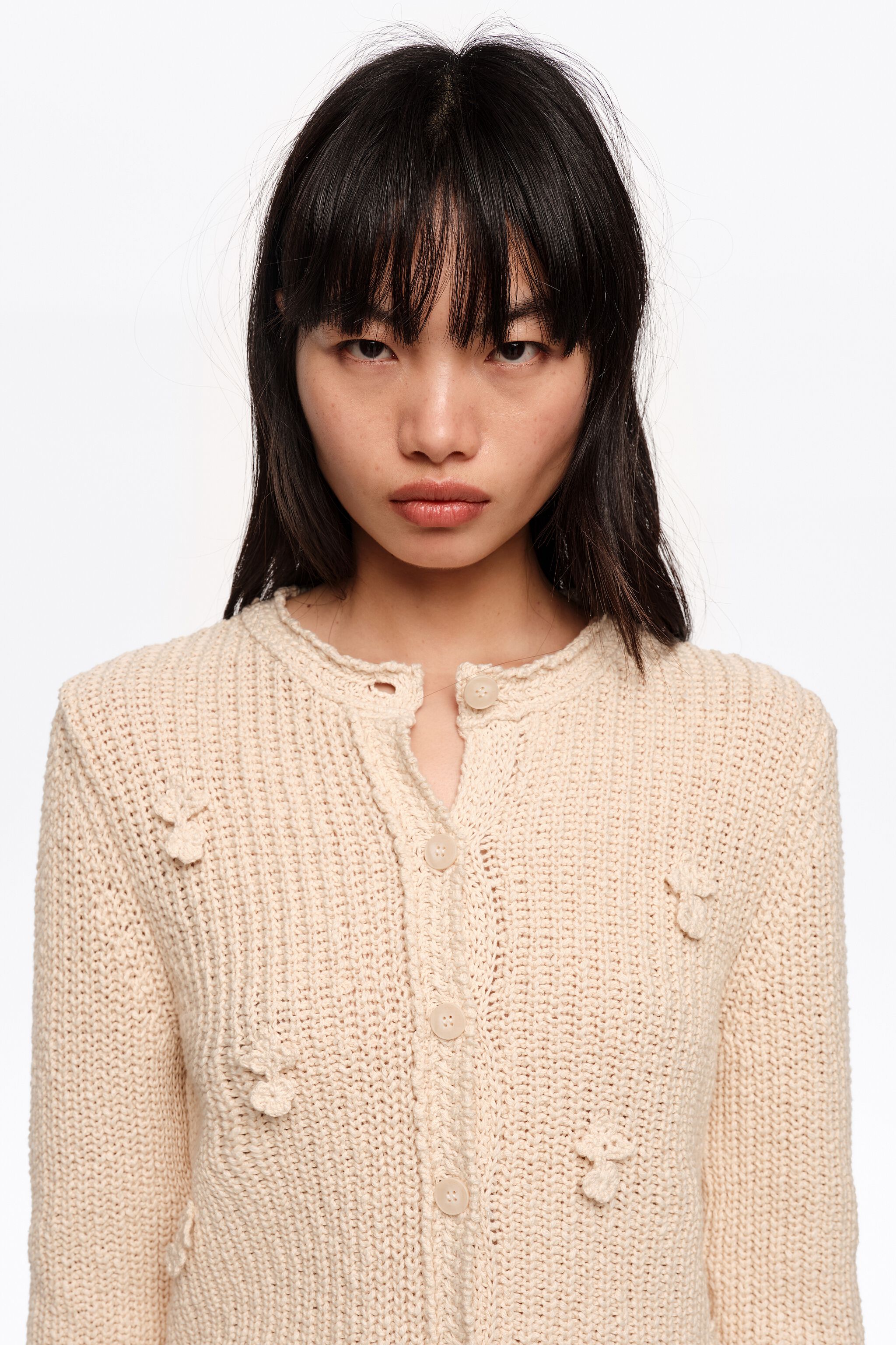 Jersey beige de algodón con bolas planas