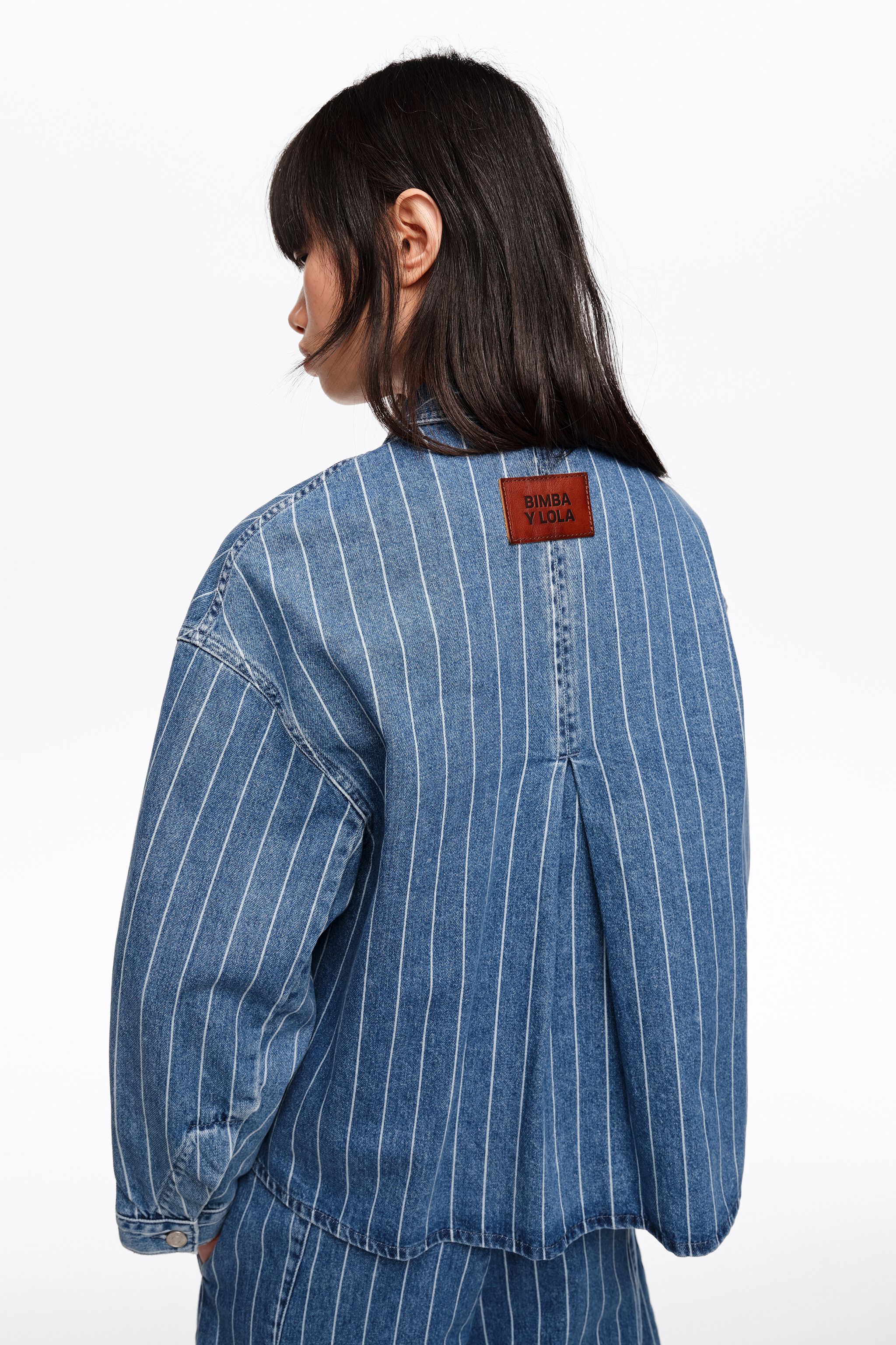 Chaqueta vaquera A-line desvanecida con rayas azules