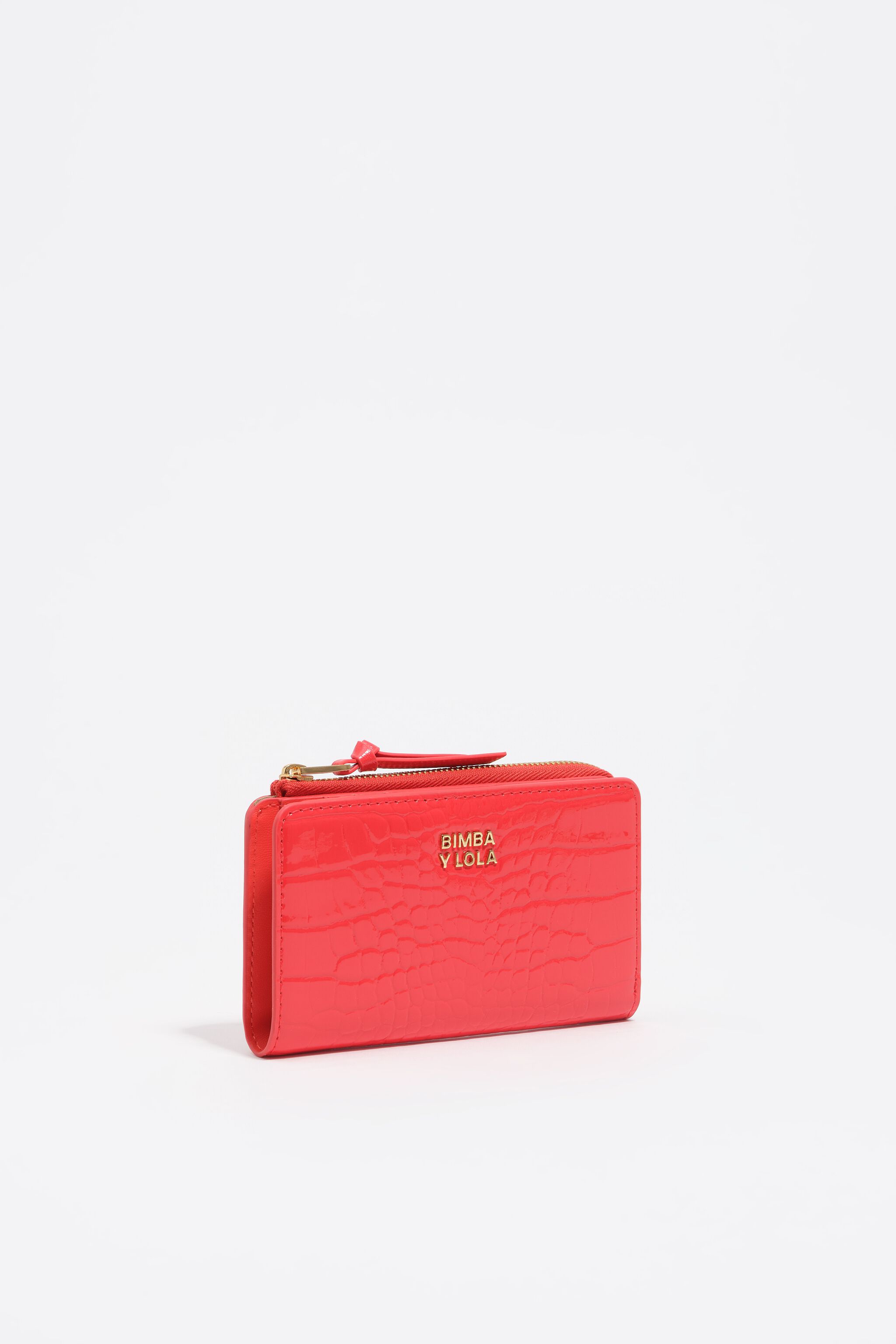 Monedero compacto de cuero sintético con efecto cocodrilo coral