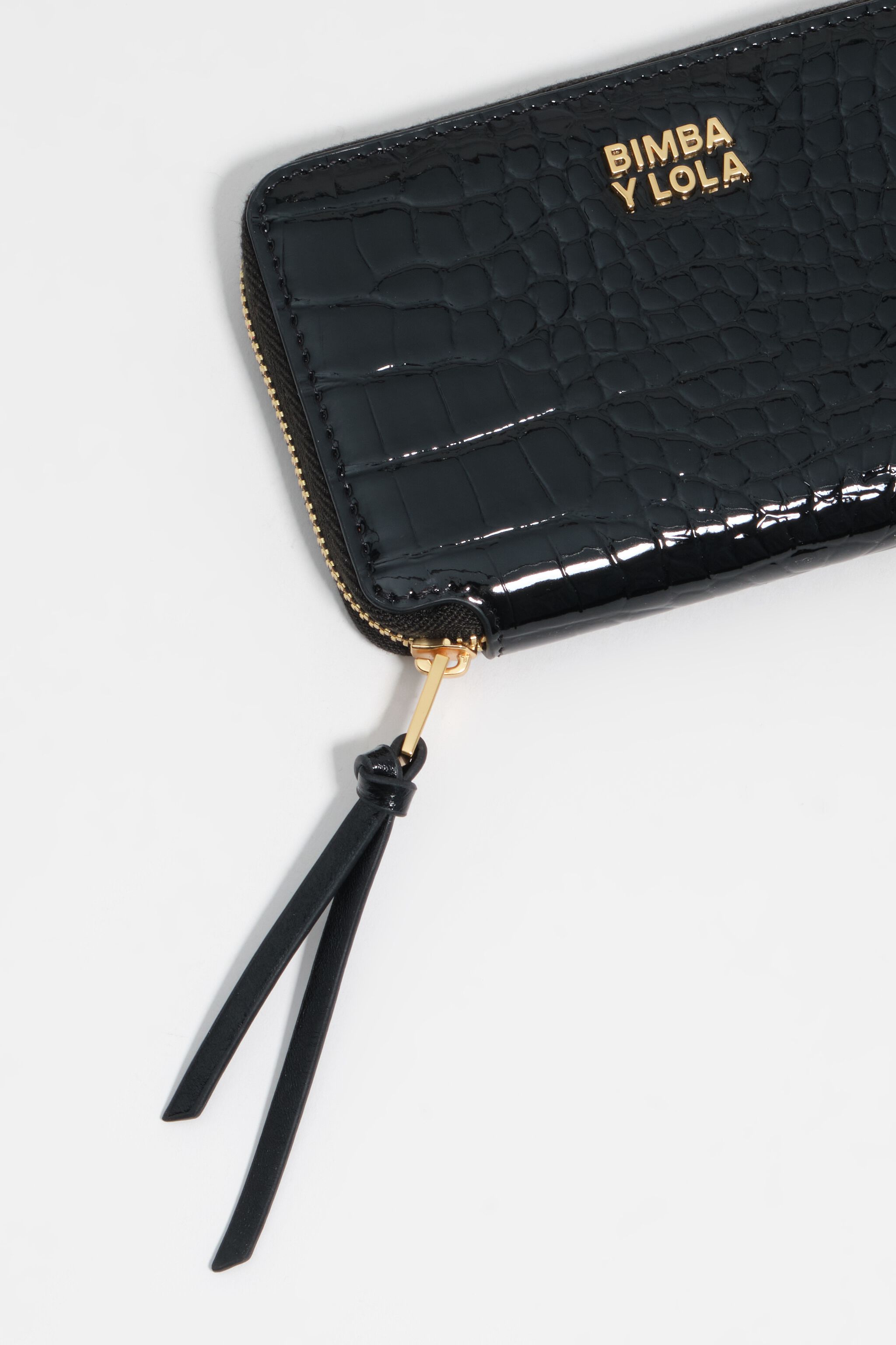 Monedero compacto de cuero de cocodrilo estampado negro