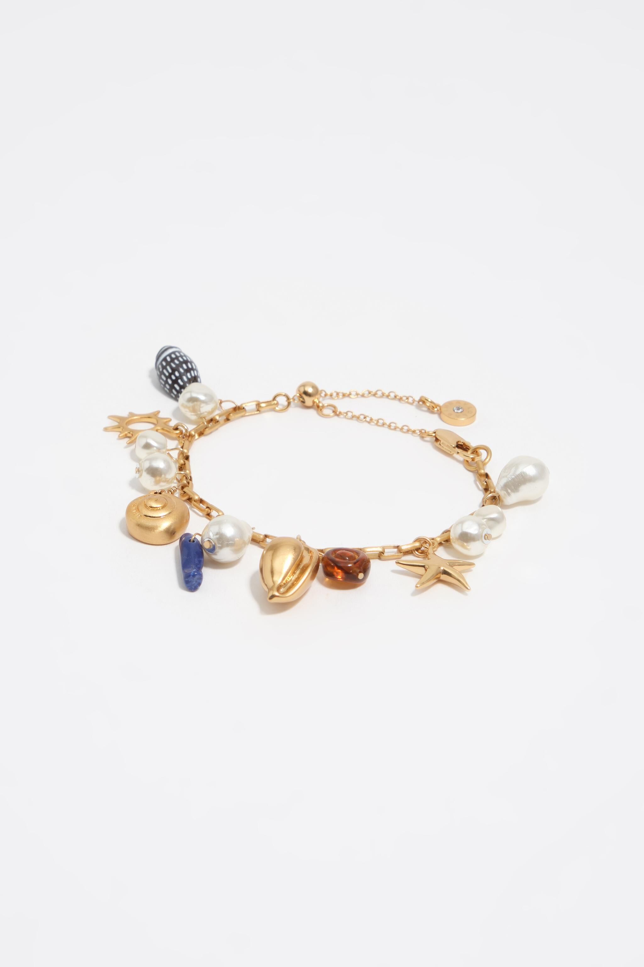 Pulsera de perla mate dorada y concha marina