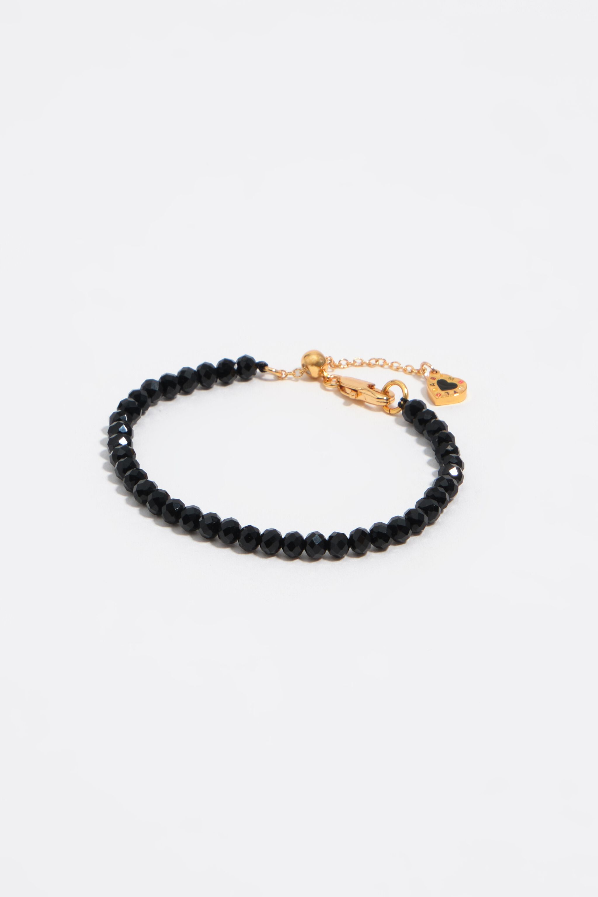 Pulsera de cristal con logotipo de corazón negro