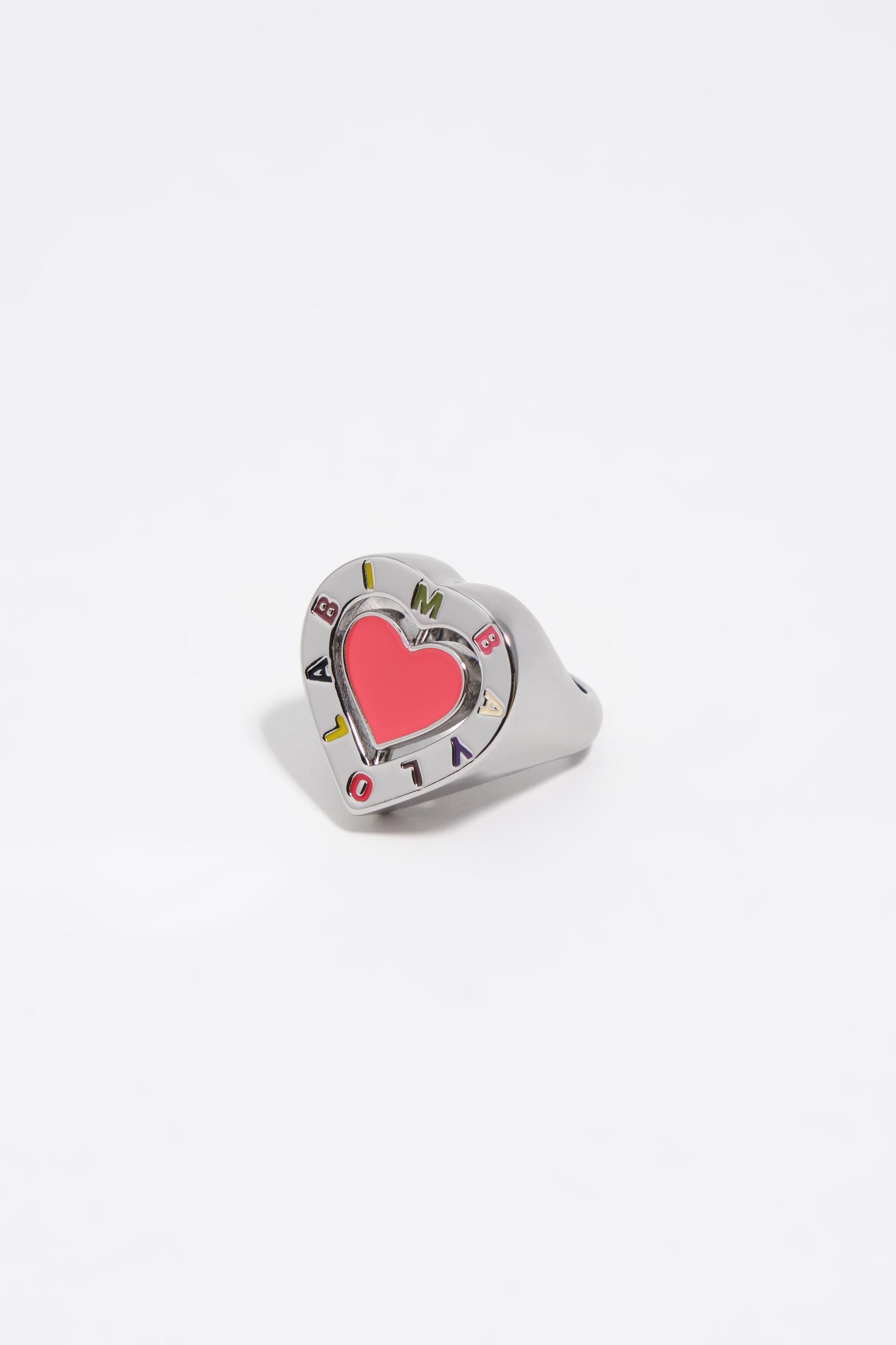Anillo de corazón con logotipo giratorio plateado