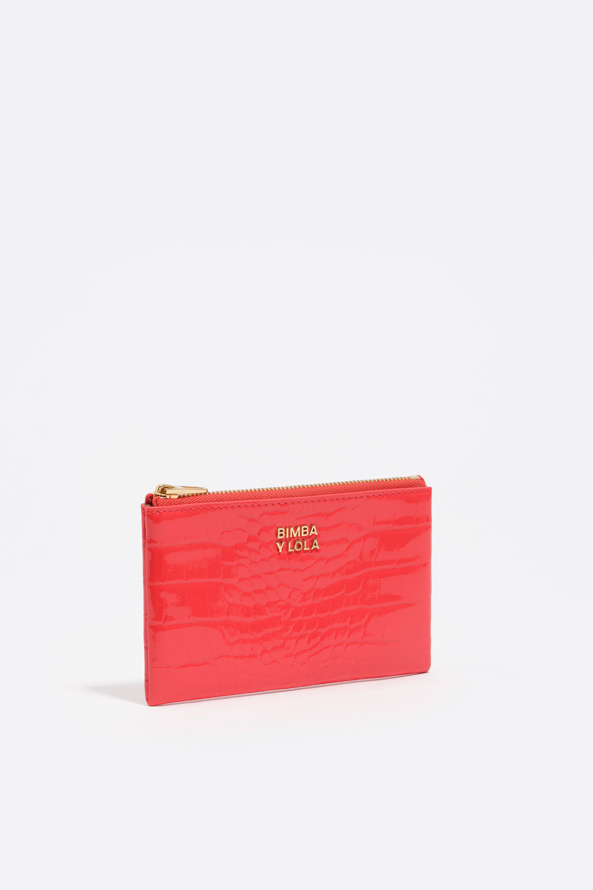 Monedero con forma de cocodrilo de color coral