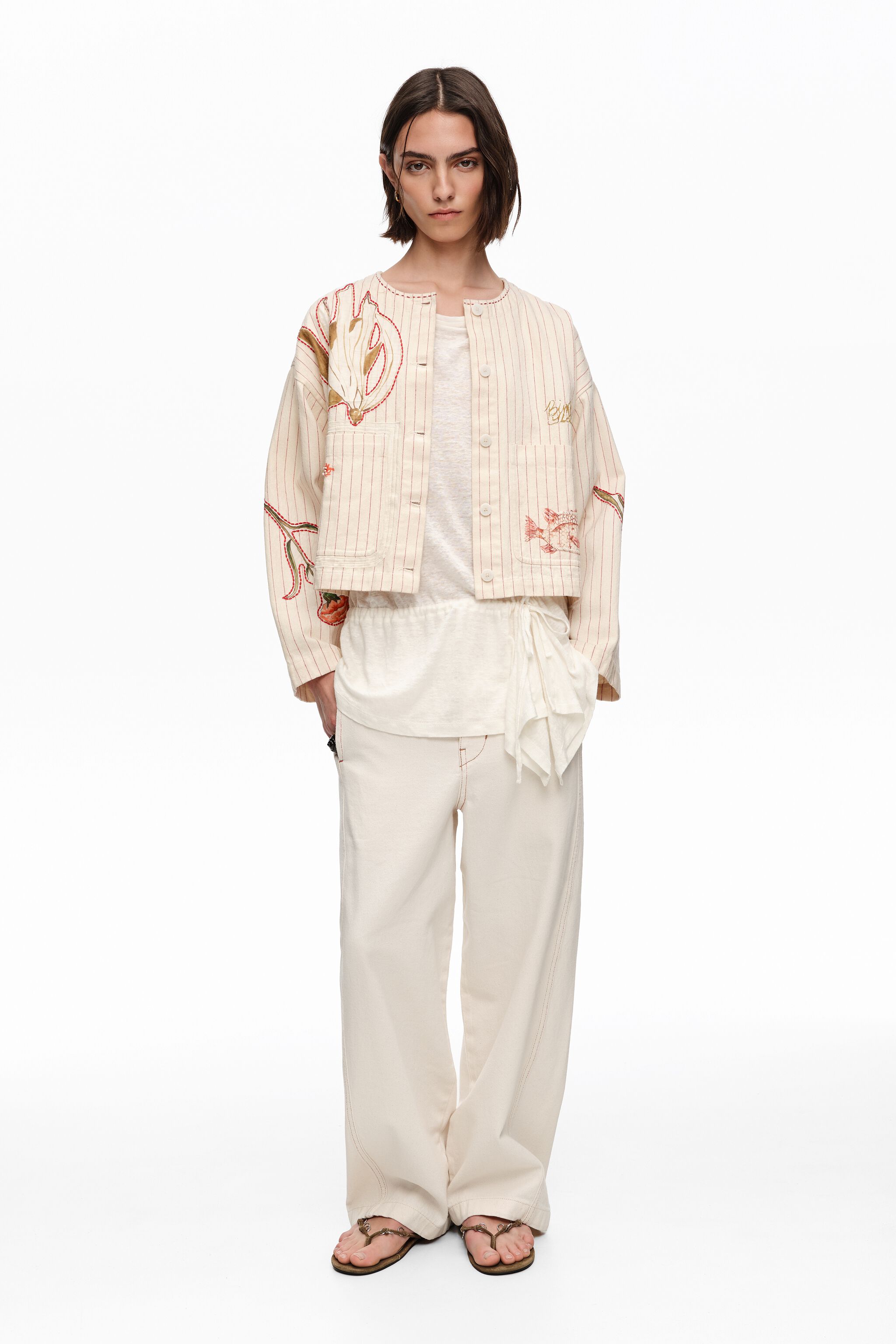 Chaqueta ivory con puntadas y estampados de rayas
