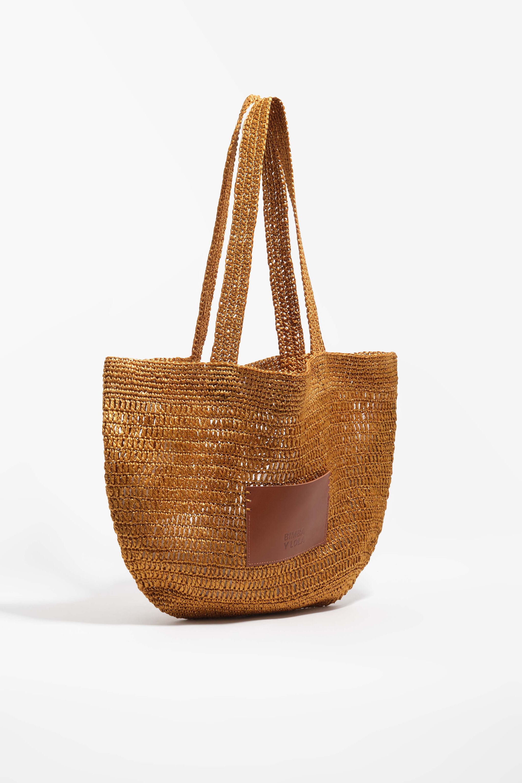 Bolso grande con trenzado dorado