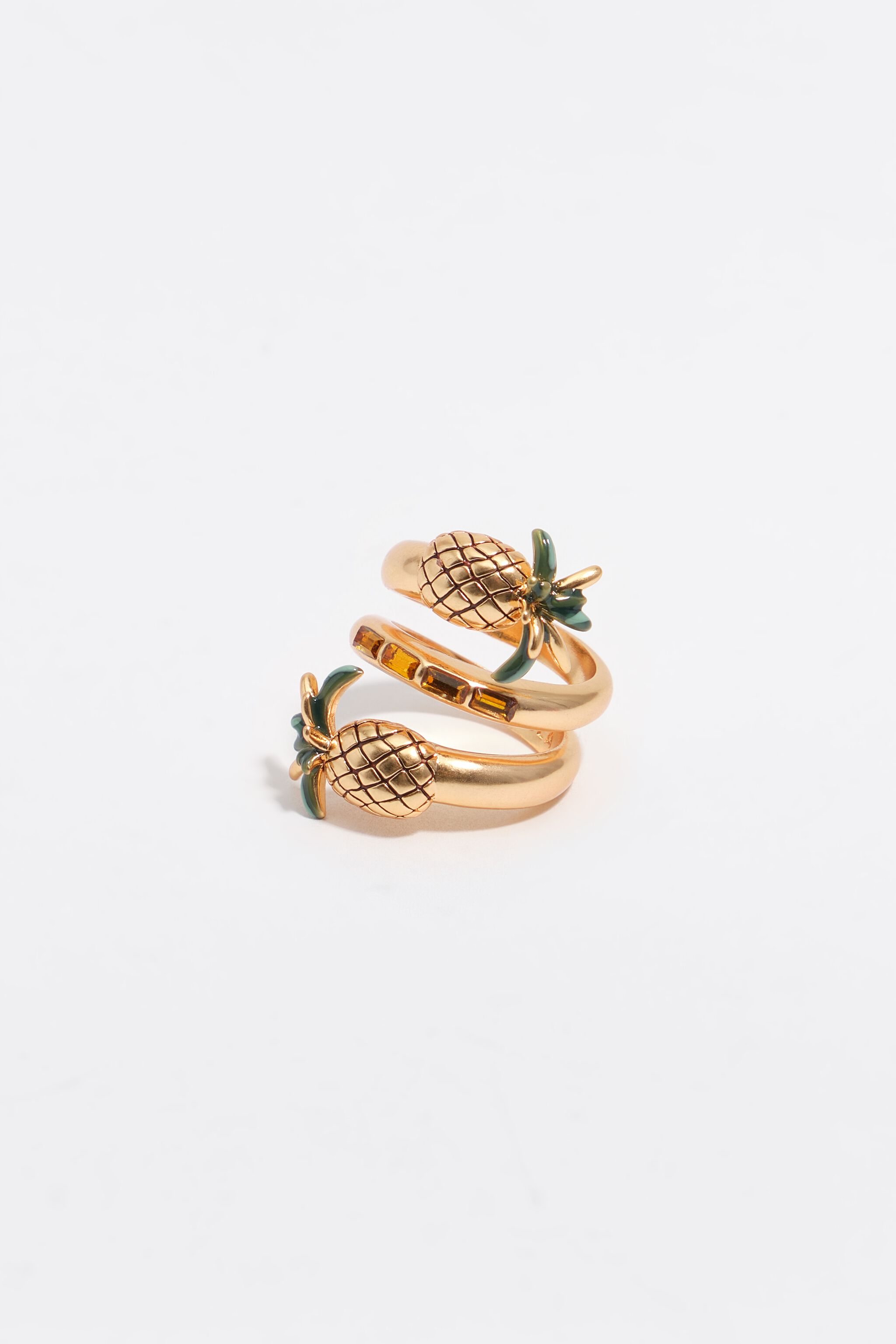 Anillo espiral de piñas doradas y cristales