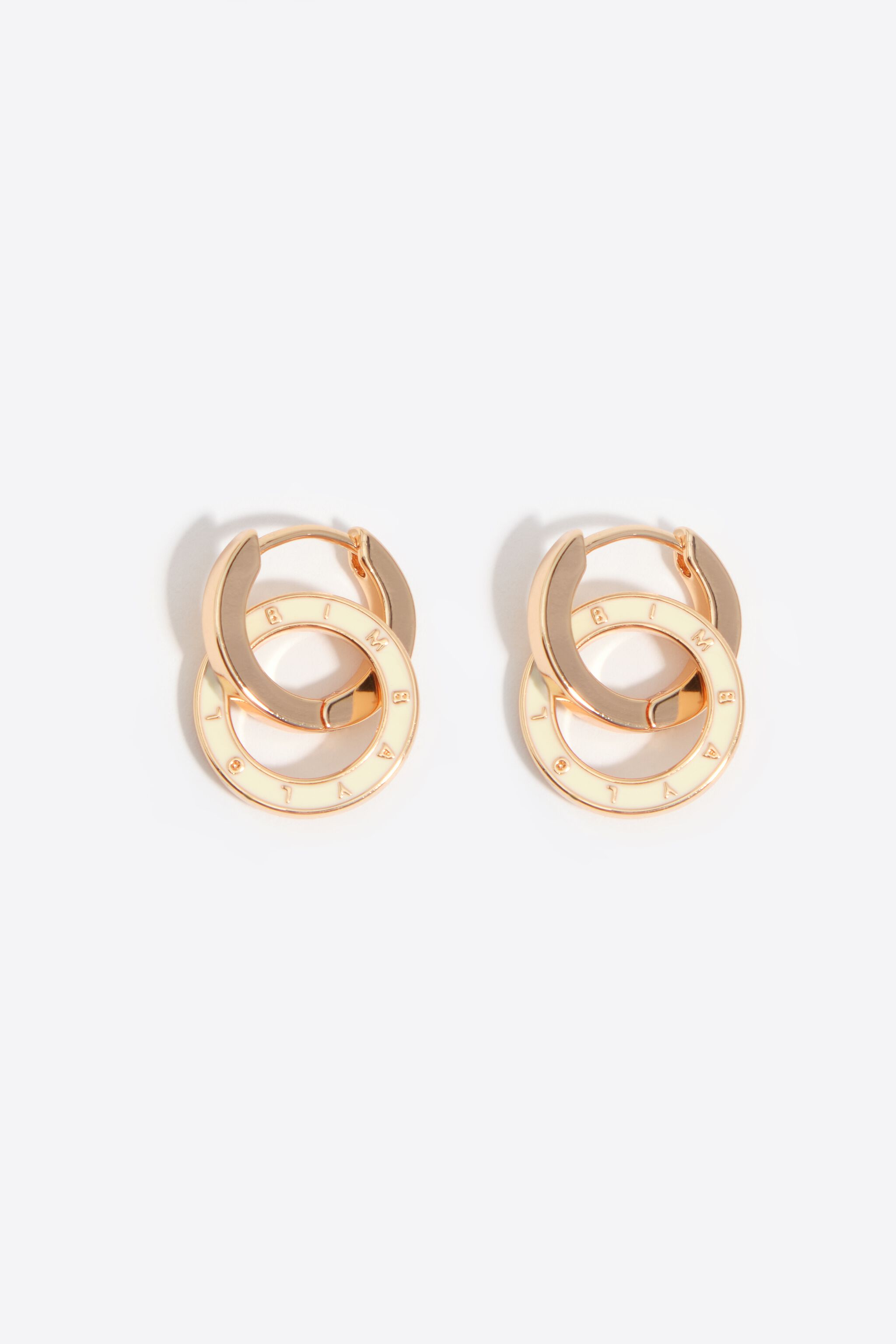 Aretes de doble aro con logotipo marfil