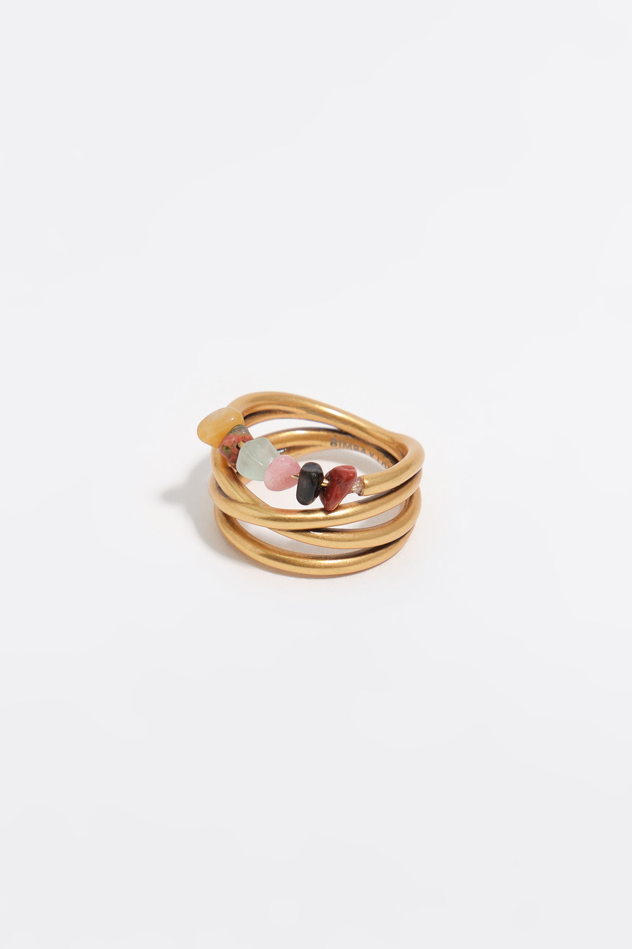Anillo de bandas cruzadas y piedras en dorado mate