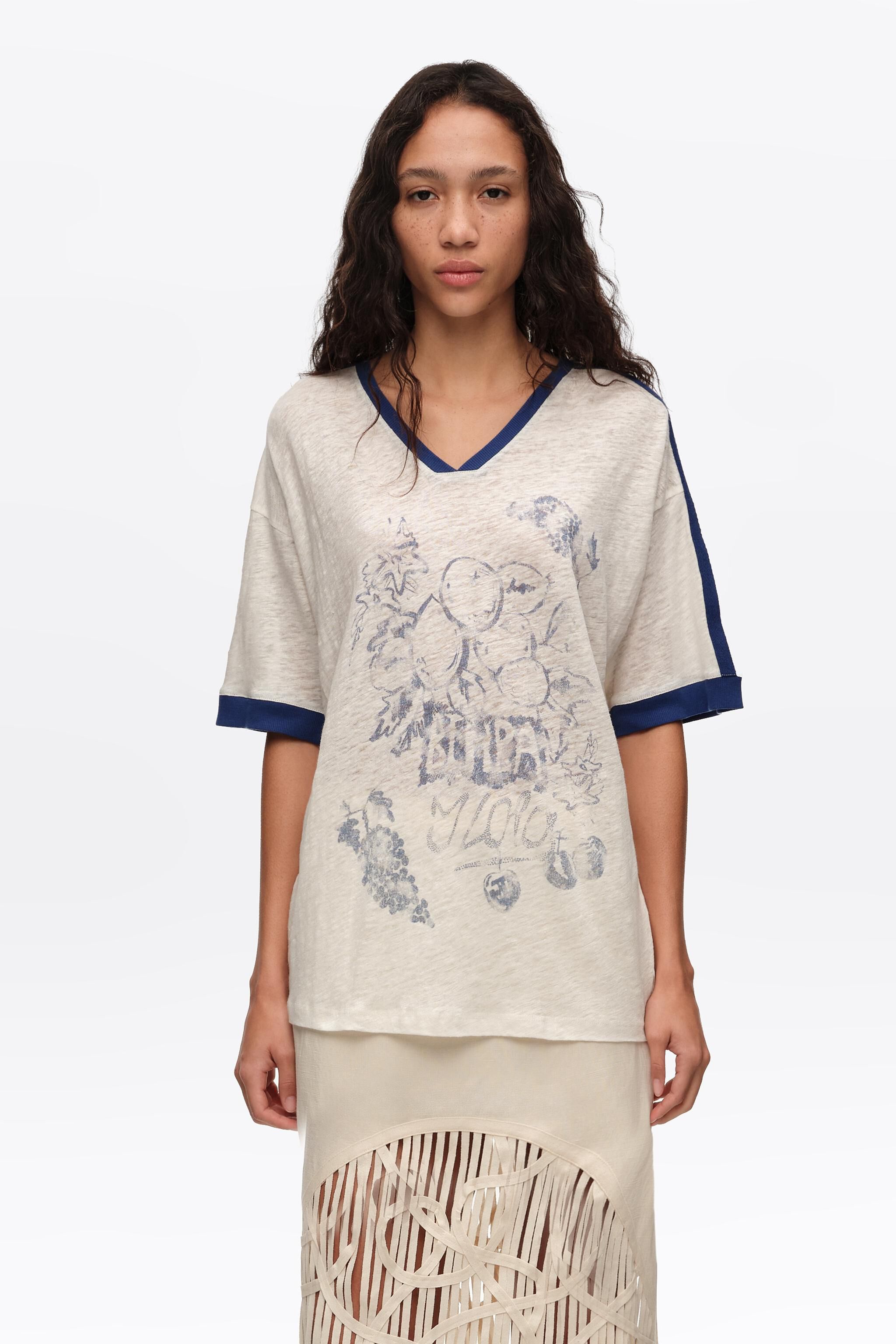 Camiseta de lino marfil desvanecido con logo de fruta