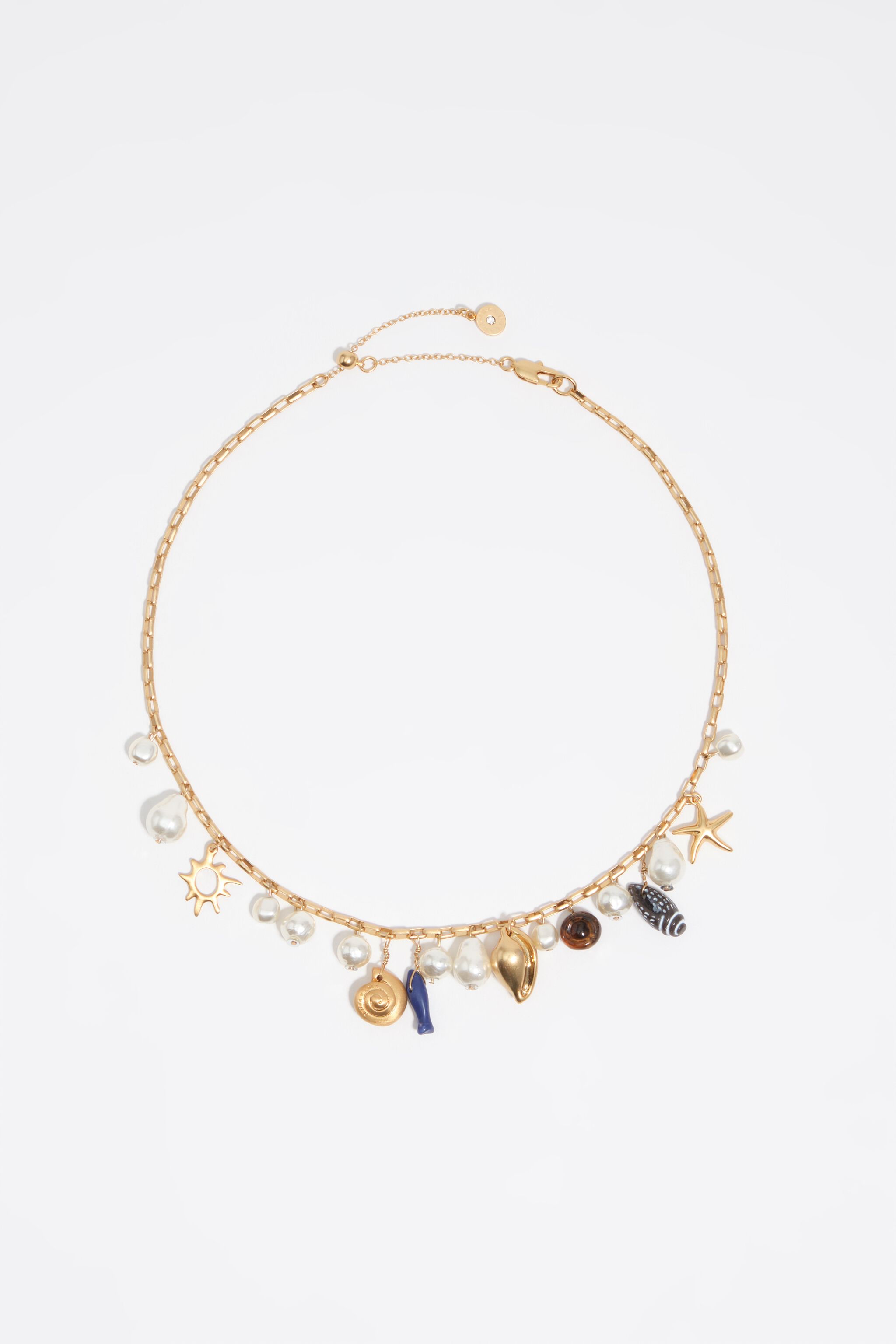 Collar de oro envejecido con conchas y peces