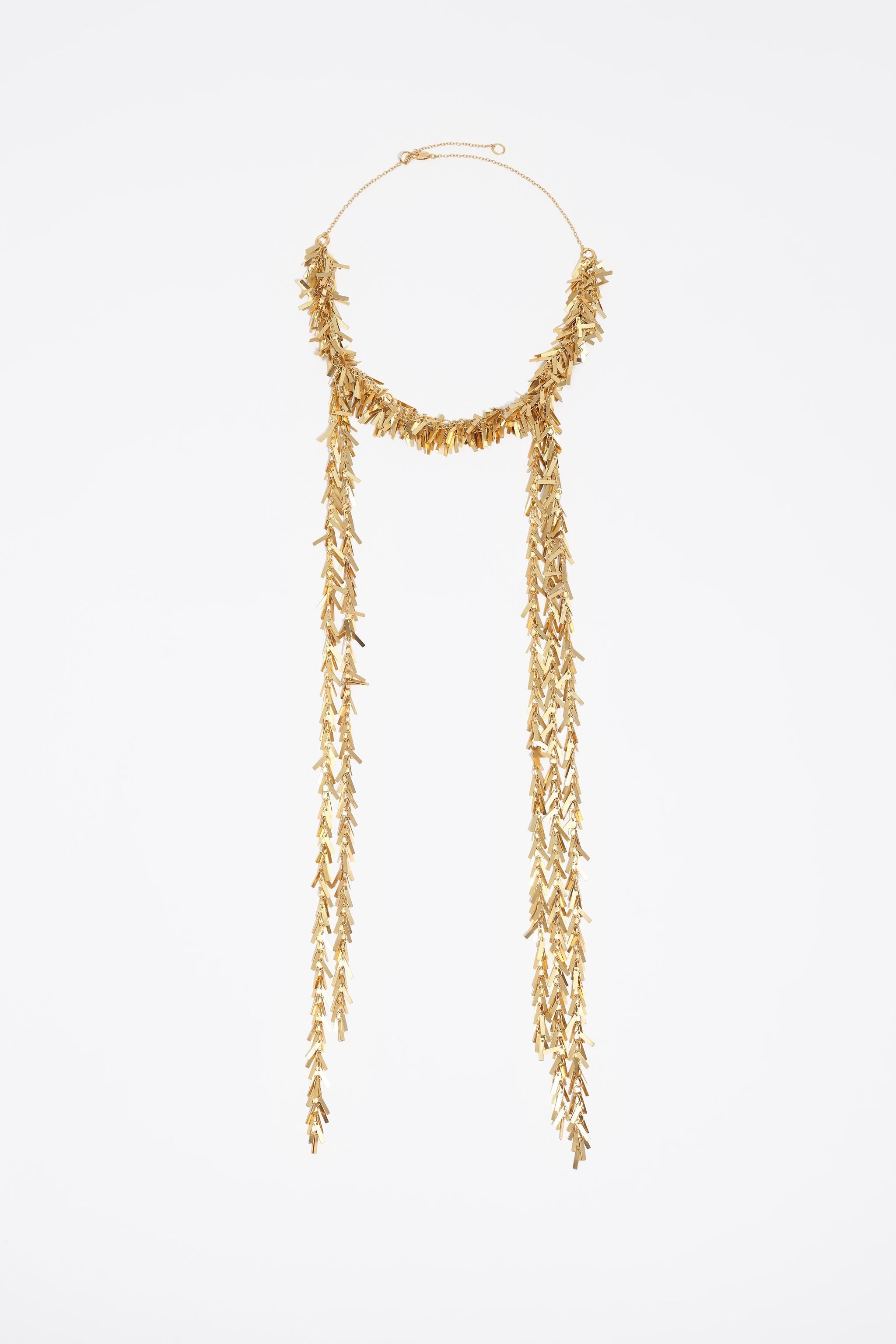 Collar de cadena de metal dorado envejecido con flecos