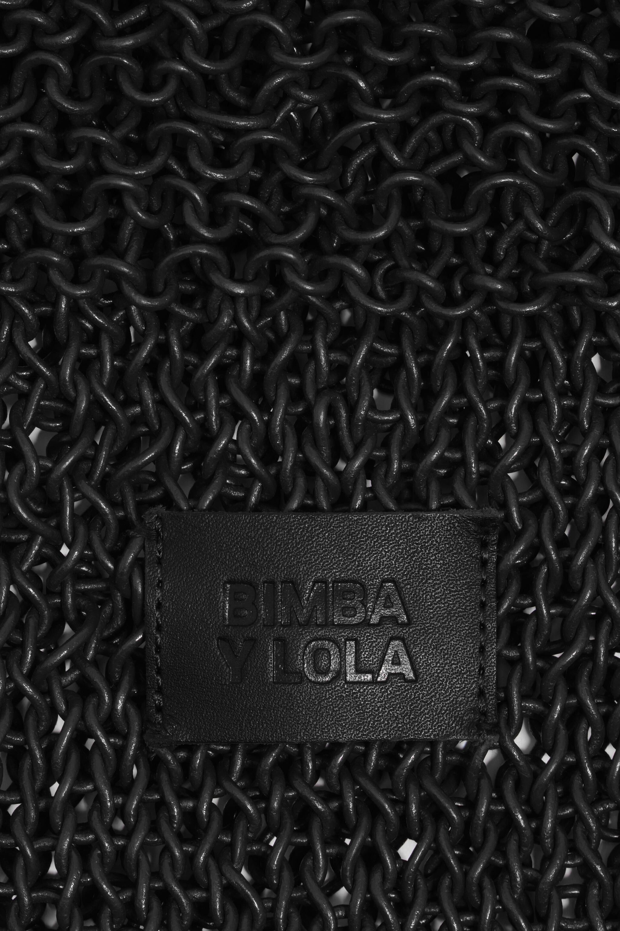 Bolso bandolera negro trenzado de cuero