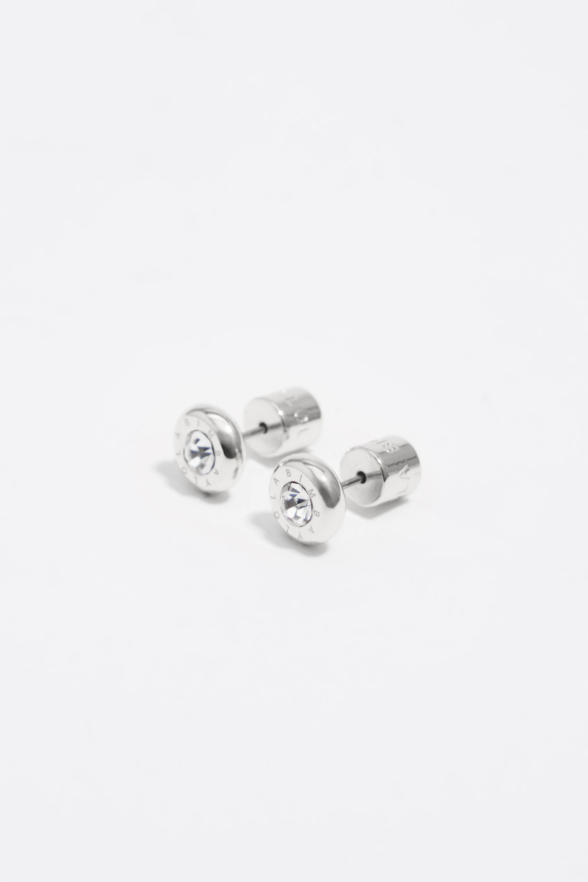 Auriculares de plata con logotipo y cristal